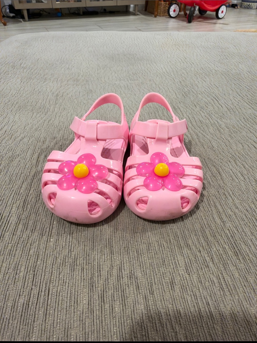 CROCS Kids Pink Jelly Sandals with Hot Pink Daisy and Yellow Center